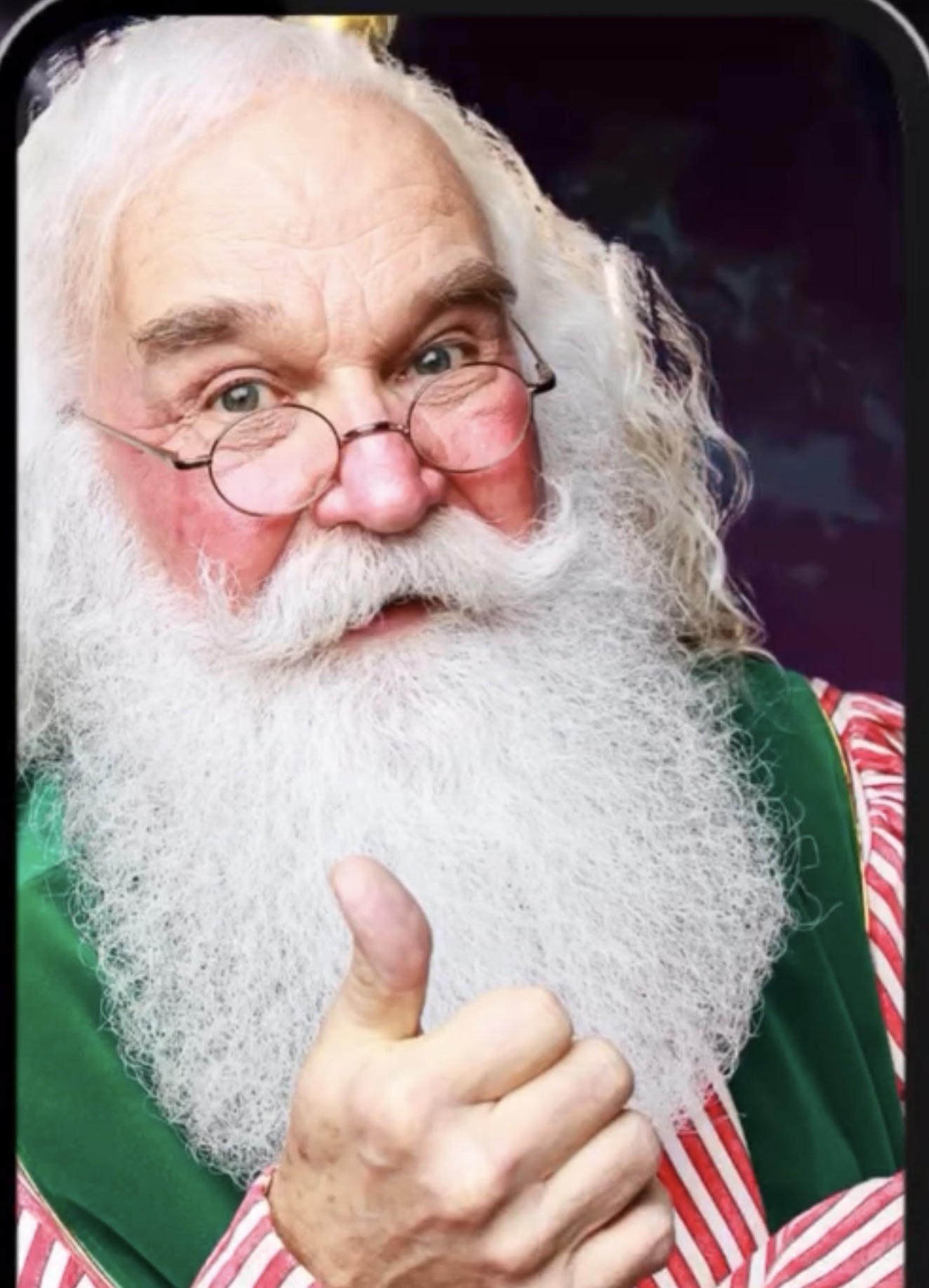 Santa Corky smiling and giving families a thumbs up